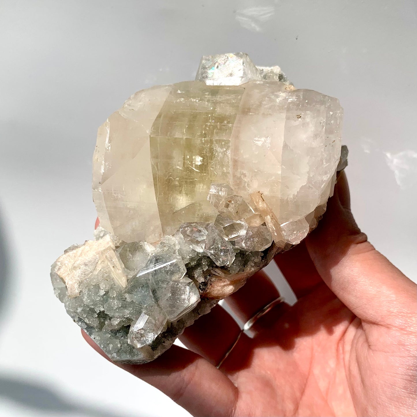 Big Green Apophyllite and Peach Stillbite on Raw Chalcedony