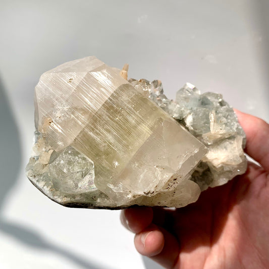 Big Green Apophyllite and Peach Stillbite on Raw Chalcedony