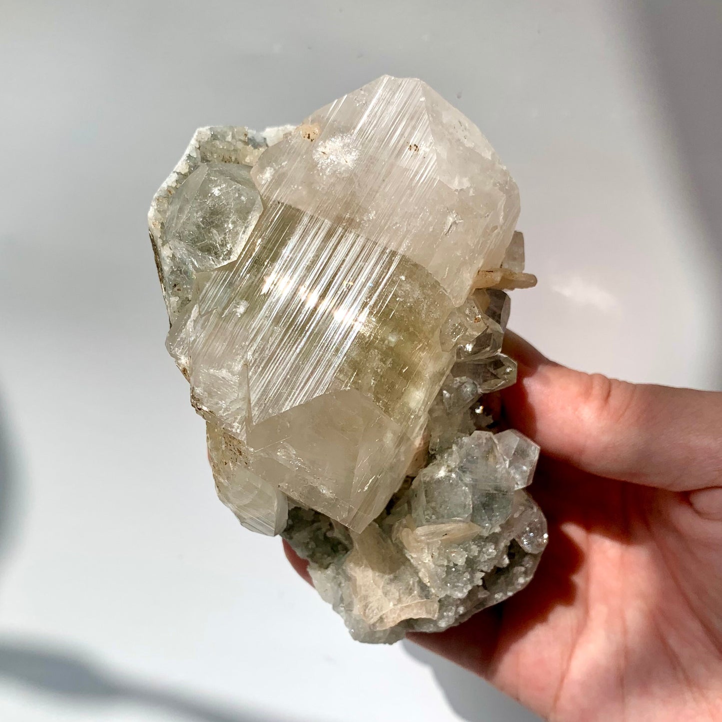 Big Green Apophyllite and Peach Stillbite on Raw Chalcedony